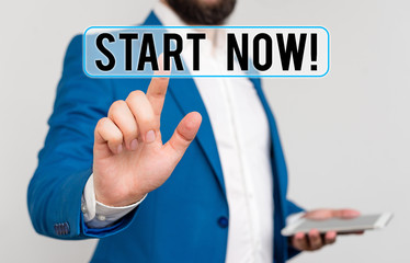 Conceptual hand writing showing Start Now. Concept meaning do not hesitate get working or doing stuff right away Businessman with pointing finger in front of him