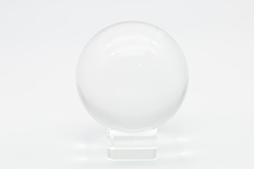 Transparent crystal glass sphere ball  on a white background Light