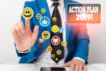 Conceptual hand writing showing Action Plan 2019. Concept meaning proposed strategy or course of...