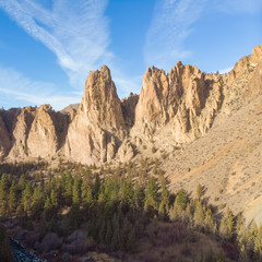 Obraz premium Rocks in a beautifully large canyon, desert with river. Smith Rock State Park National Park. Oregon State. Top view. Square photo.
