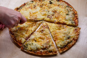 Home cooked pizza on a wooden board