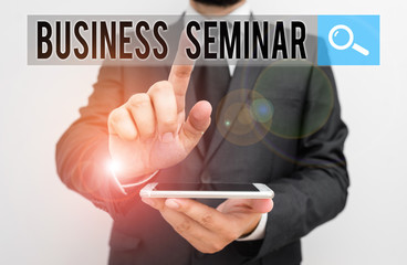 Writing note showing Business Seminar. Business concept for discussion in a small group in which the result of research Male human wear formal work suit hold smartphone using hand