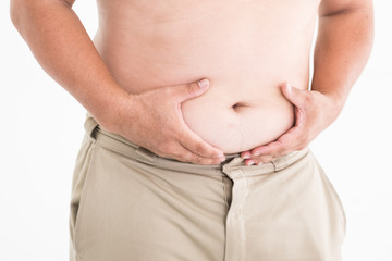 Naklejka premium Fat man checking out his weight isolated