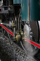 Bangkok,Thailand-December 5, 2019: Driving wheels and coupling rods on a steam locomotive made in Japan