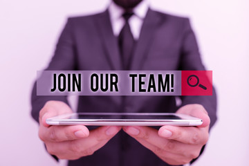 Text sign showing Join Our Team. Business photo text inviting someone into your local group or company Male human wear formal work suit hold smart hi tech smartphone use hands