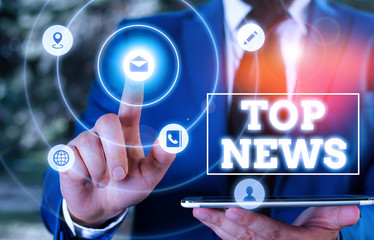 Conceptual hand writing showing Top News. Concept meaning information that is being received and...