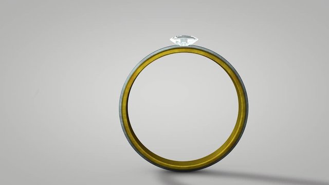 3D render of a beautiful gold and silver diamond wedding ring closeup on white background seamless looping spinning