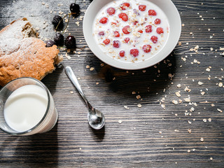 delicious healthy Breakfast with milk on a wooden table amid the mess
