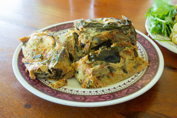 Steamed fish with curry paste on the plate