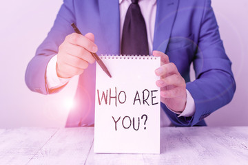 Handwriting text Who Are You question. Conceptual photo asking about demonstrating identity or...