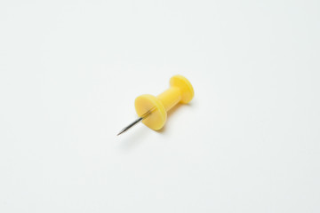 Close up of Yellow pin  on white background
