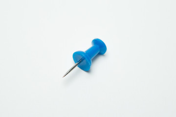 Close up of Blue pin  on white background