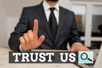 Obraz premium Conceptual hand writing showing Trust Us. Concept meaning to believe that someone is good and honest and will not harm Male human wear formal clothes present use hitech smartphone