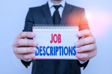 Writing note showing Job Descriptions. Business concept for a formal account of an employee s is...