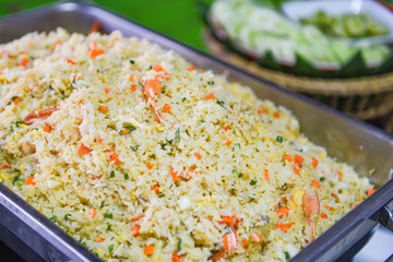 Thai food buffet fried rice shrimp carrot and vegetables on tray in the dining table /
