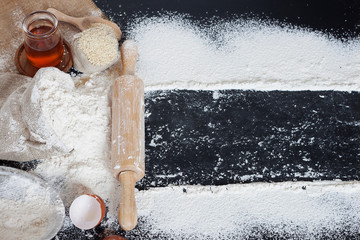Wheat flour bags with various accessories And with white powder spreading on the table There is space to write a message - top view.