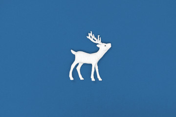 New Year and Christmas decoration. White deer. Top view, from above. Trendy color of the year 2020.