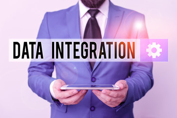 Text sign showing Data Integration. Business photo text involves combining data residing in different sources Businessman in blue suite with a tie holds lap top in hands