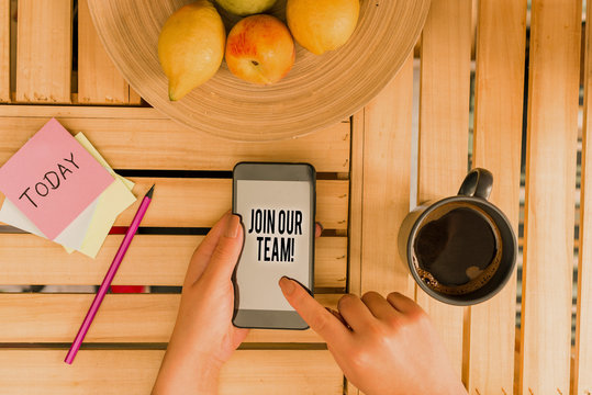 Word writing text Join Our Team. Business photo showcasing invite someone to work together for particular purpose target woman computer smartphone drink mug office supplies technological devices