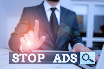 Conceptual hand writing showing Stop Ads. Concept meaning program that will remove different kinds...