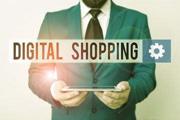 Text sign showing Digital Shopping. Business photo text act of purchasing products or services over the Internet Businessman in blue suite with a tie holds lap top in hands