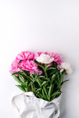 Creative layout made with pink and white peonies flowers on white background. Flat lay. Spring Seasonal valentine, woman, mother, 8 march holiday