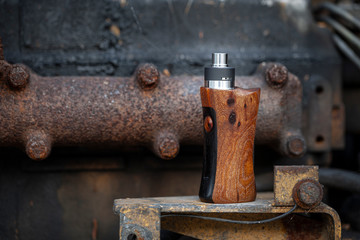 high end rebuildable dripping atomizer with stabilized natural walnut wood regulated box mods, vaping device, selective focus