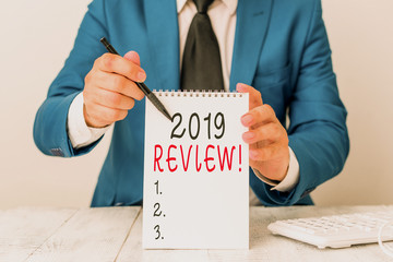 Text sign showing 2019 Review. Business photo showcasing remembering past year events main actions...
