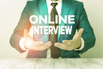 Conceptual hand writing showing Online Interview. Concept meaning method conducted using...