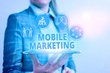 Conceptual hand writing showing Mobile Marketing. Concept meaning promotional activity designed for...