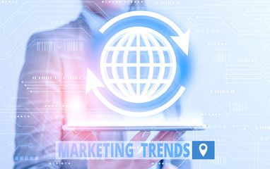 Conceptual hand writing showing Marketing Trends. Concept meaning changes and developments in...