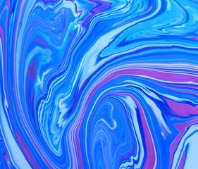 Bright abstract marble pink and blue background. Acrylic paint flows freely and creates an...