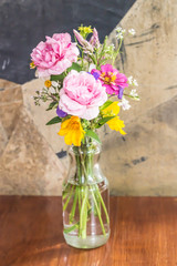 Beautiful flower arrangement in glass vase on the table