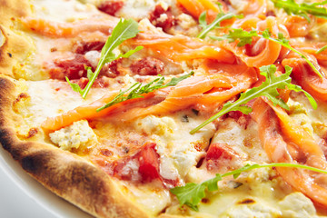 Pizza with Salmon, Cream Cheese and Fresh Rucola Leaves Isolated Side View