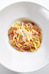 Macro Photo of Spaghetti Carbonara with Grated Parmesan and Bacon