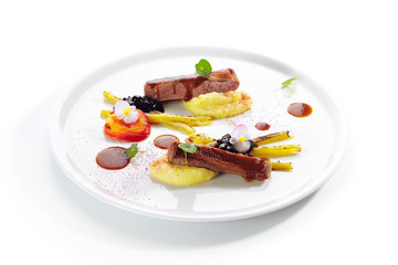 Fried Duck Breast with Baked Plum and Glazed Rhubarb Isolated