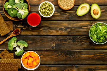 Diet program concept. Set of fresh vegatables and fruits on dark wooden background top view frame copy space