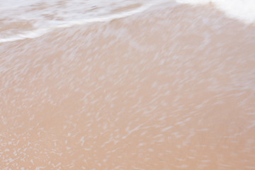Fototapeta premium The sea and the waves on the sandy beach