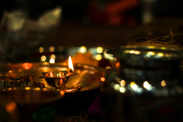 Traditional indian wedding ceremony in Hinduism : puja thali and oil lamp 