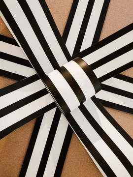 Closeup of gift wrapping with beautiful brown and white stripes ribbon. Suitable for celebrations such as Christmas, wedding, birthday, new year, graduations and other occasions