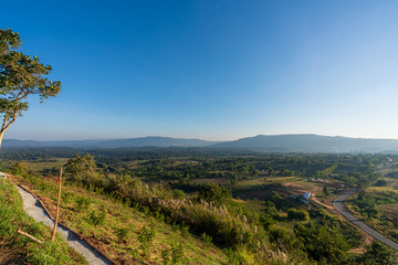 Naklejka premium beautiful blue sky high peak mountains mist fog wildlife green forest at Khao Koh Phu Tub Berk Phetchabun Thailand guiding idea long weekend for backpacker camping hiking 