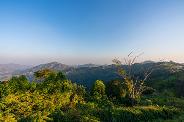 beautiful blue sky high peak mountains mist fog wildlife green forest at Khao Koh Phu Tub Berk Phetchabun Thailand guiding idea long weekend for backpacker camping hiking  