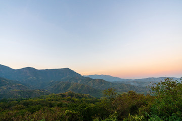 beautiful blue sky high peak mountains mist fog wildlife green forest at Khao Koh Phu Tub Berk Phetchabun Thailand guiding idea long weekend for backpacker camping hiking  