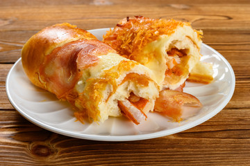 side view bread with bacon and shredded pork