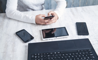 Business girl using smartphone in office.
