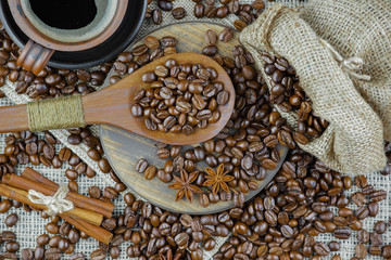 Coffee grains on a table with accessories for coffee