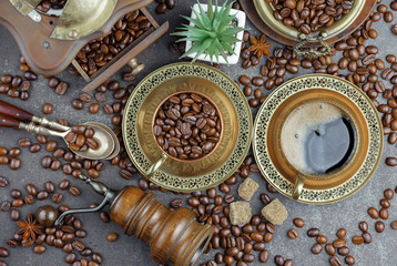 Coffee grains on a table with accessories for coffee