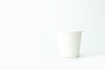 Paper cup with copy space on isolated white background