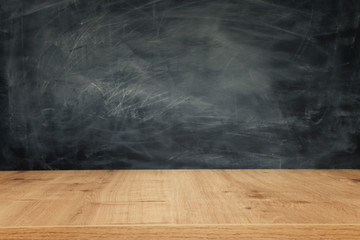 Education image – empty table and blackboard - Powered by Adobe