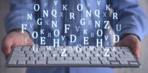 Man holding computer keyboard. Letters